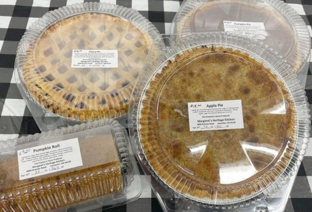 An assortment of baked goods- pies and pumpkin roll